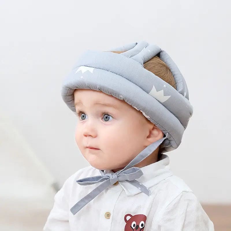 Soft, adjustable, protective baby helmet.