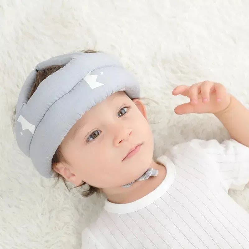 Soft, adjustable, protective baby helmet.