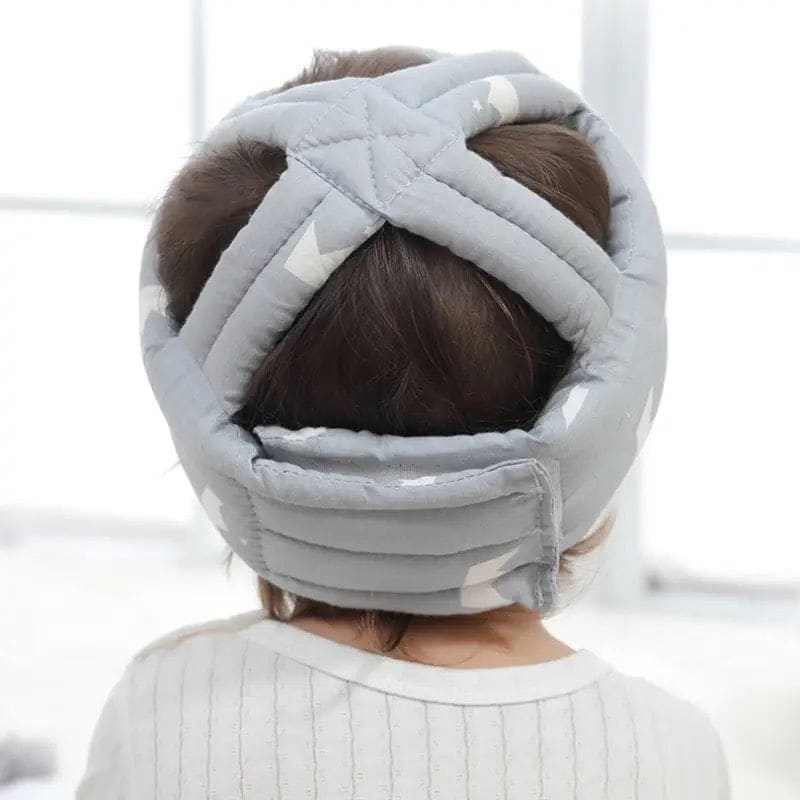 Soft, adjustable, protective baby helmet.