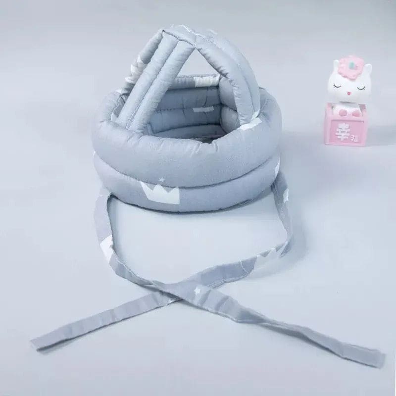 Soft, adjustable, protective baby helmet.