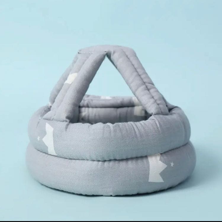 Soft, adjustable, protective baby helmet.