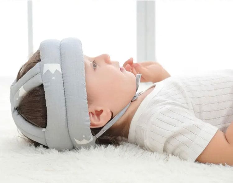 Soft, adjustable, protective baby helmet.