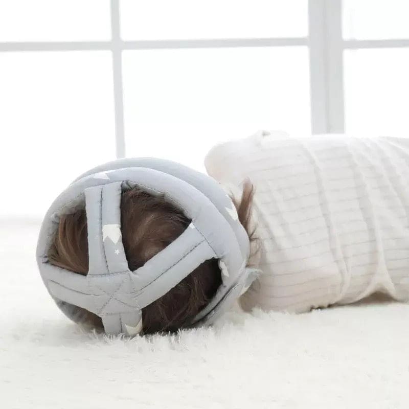 Soft, adjustable, protective baby helmet.